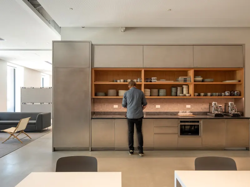 An office pantry with timber shelving