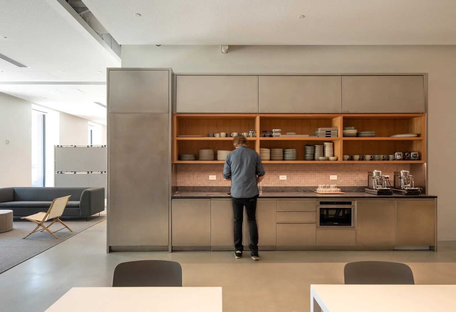 An office pantry with timber shelving